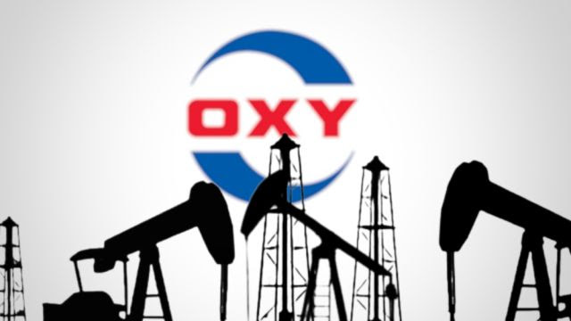 Oxy logo in front of pump jacks